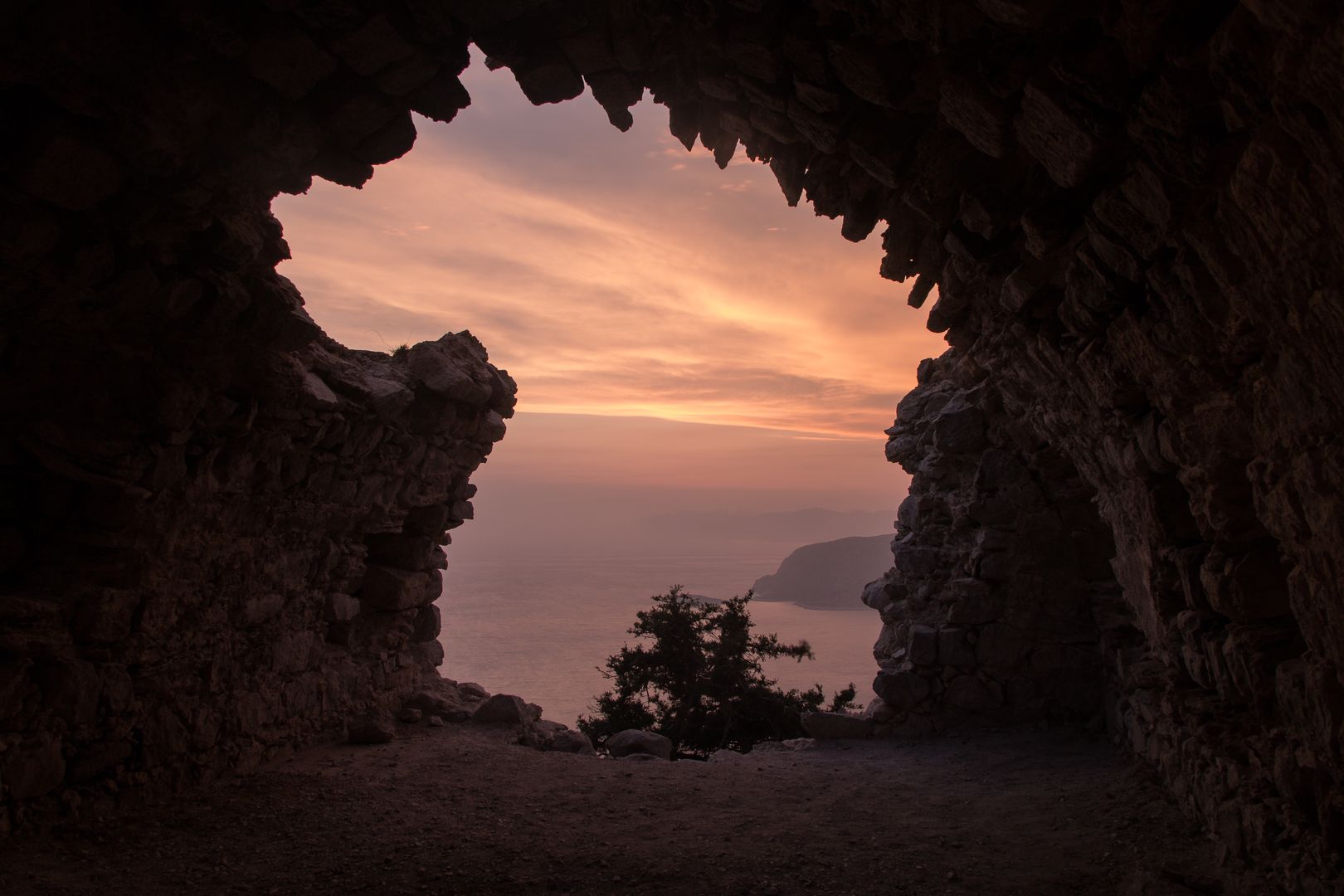 A cave entrance in Monolithos, Greece